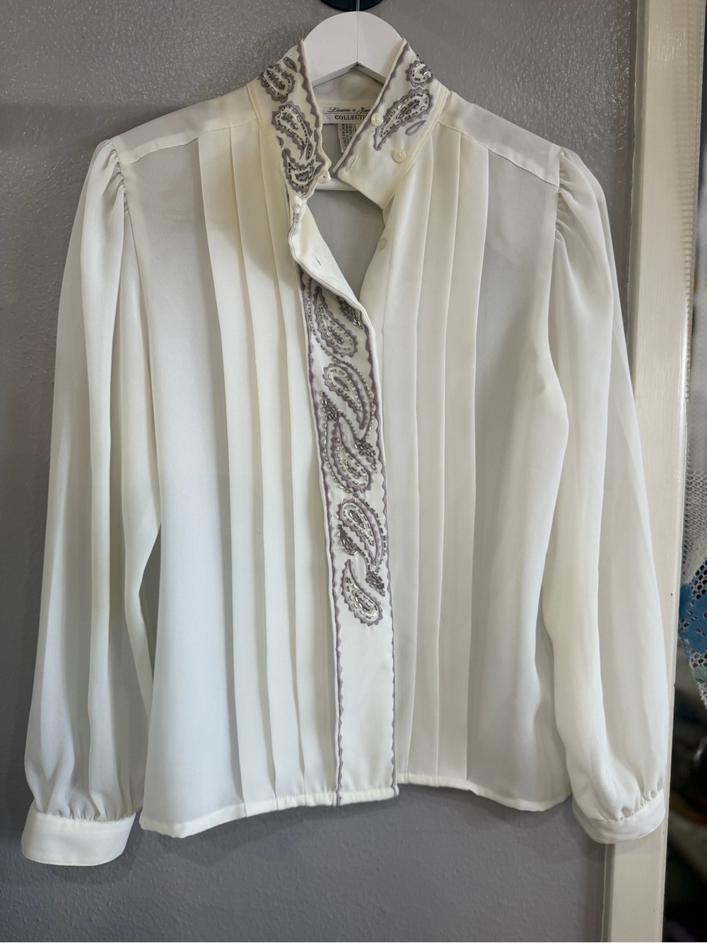 Elegant Cream Pleated Blouse with Beaded Trim